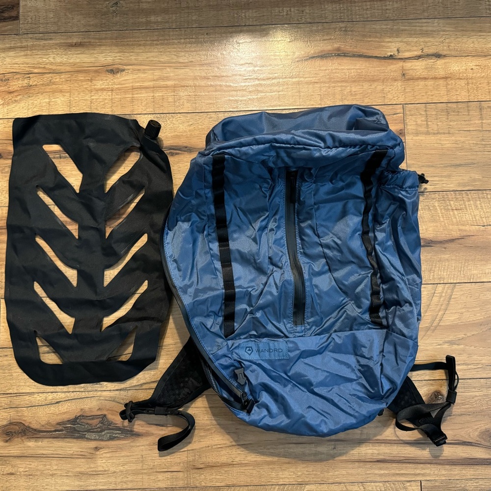 WANDRD 18L packable backpack with inflatable padded insert
